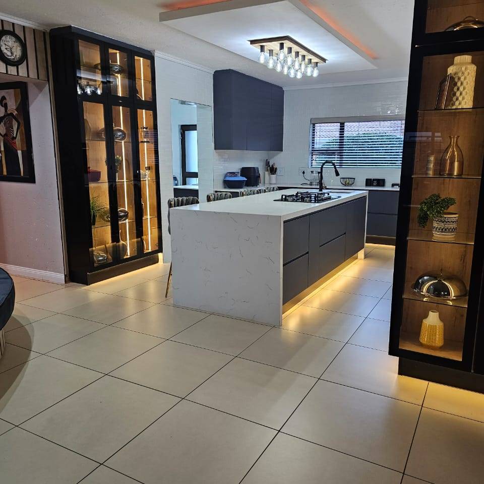 Kitchen island with quartz top and lit display units